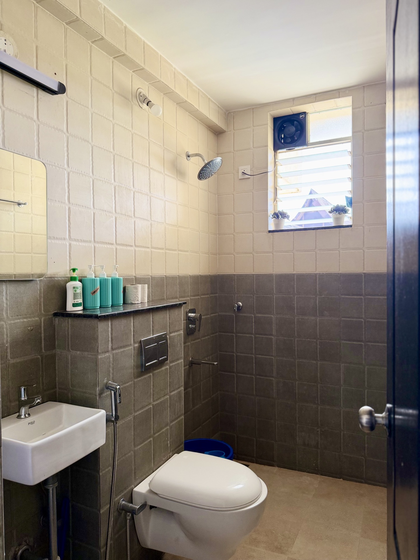 Clean bathroom with rain shower